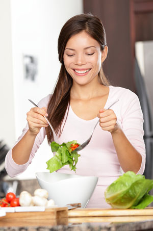 Woman making fresh salad